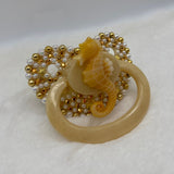Gold sea horse paci