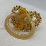 Gold sea horse paci
